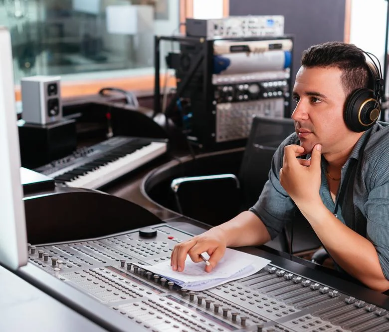 A broadcast consultant monitoring a installed system.